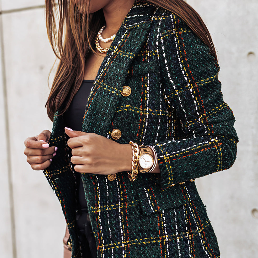 Full shot of a model wearing a double breasted plaid blazer jacket, elegant and versatile.