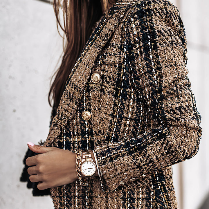 Plaid double breasted women's jacket for a sophisticated look. Checkered outerwear, fashionable.