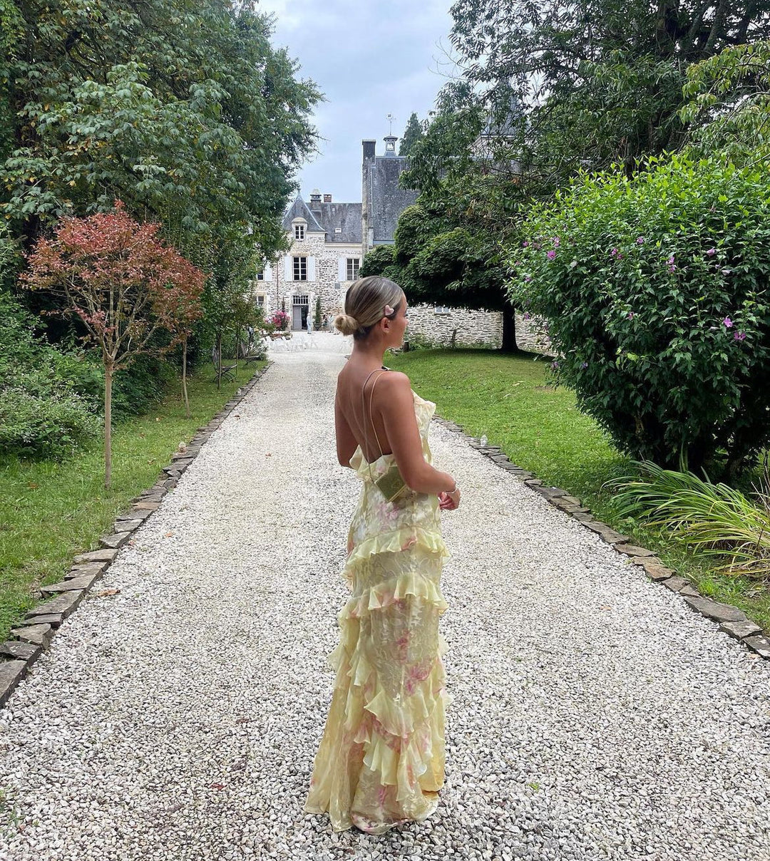 Pastel open-back maxi dress for women, featuring dreamy ruffles & a flowing design for elegant wear.