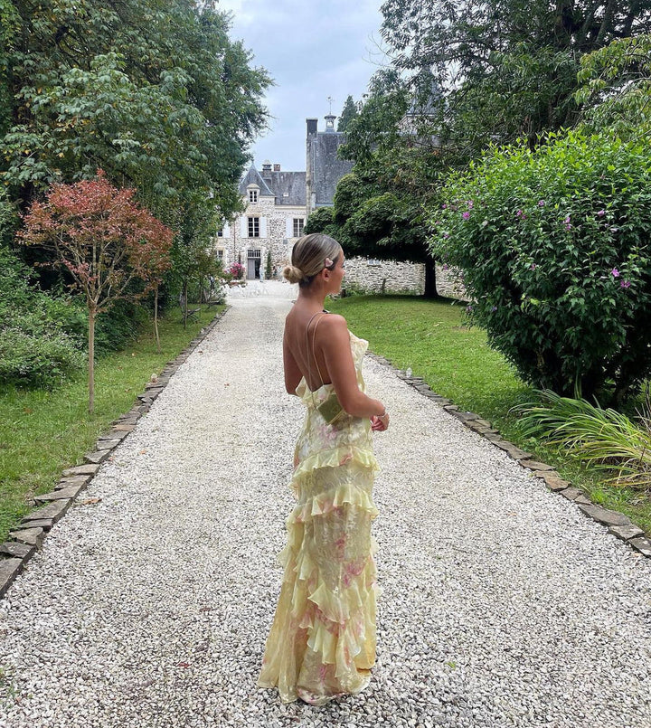 Pastel open-back maxi dress for women, featuring dreamy ruffles & a flowing design for elegant wear.