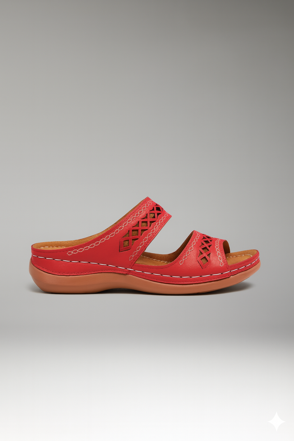 Women's dual strap slide sandals with decorative cutouts, close-up of straps and open toe.