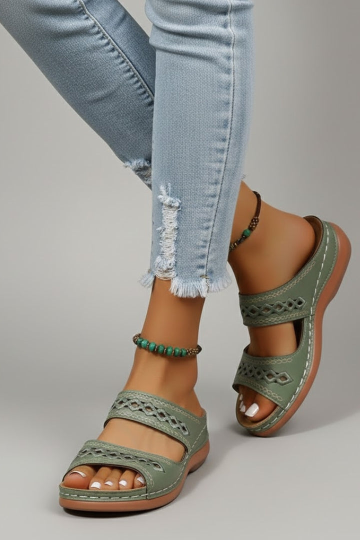 Overhead view of women's summer slide sandals featuring dual wide straps and elegant cutouts.