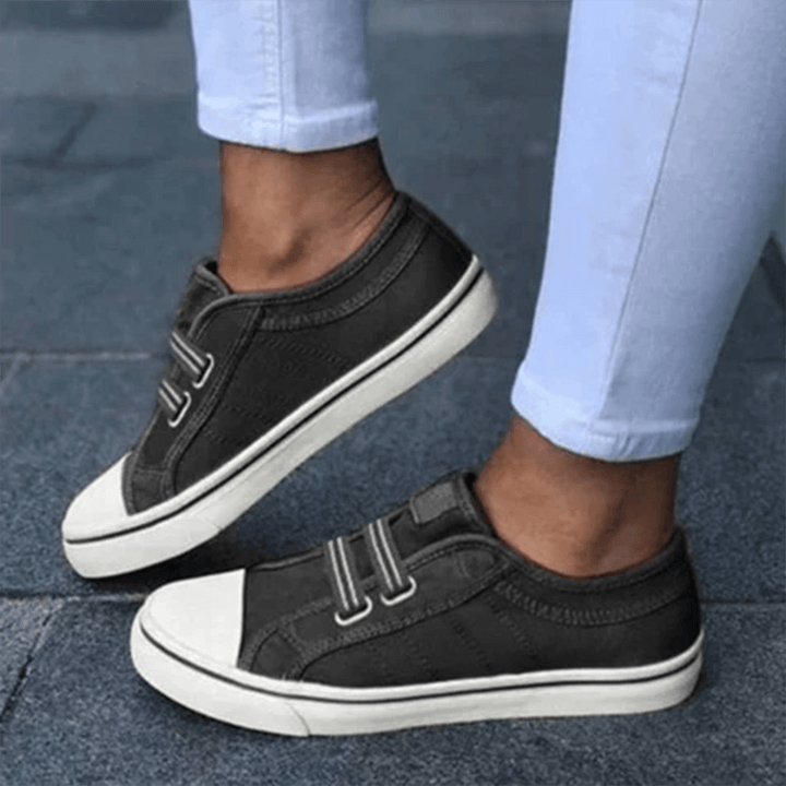 Women's easy slip-on comfort trainers in black, perfect for everyday wear and casual walking.