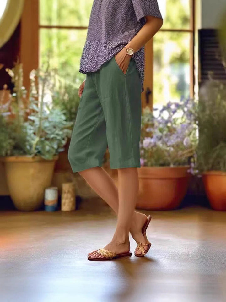 Versatile women's bermuda shorts with pockets & elastic waist. Perfect lightweight choice for summer, travel, resort.