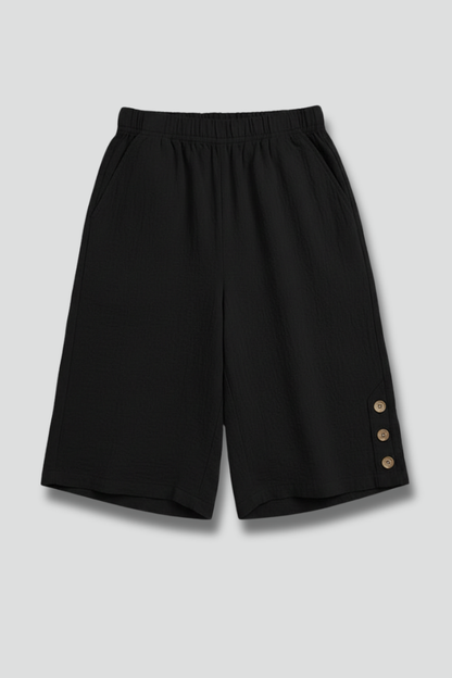 Women's elastic waist wide leg shorts with prominent button detail, perfect for summer casual wear.