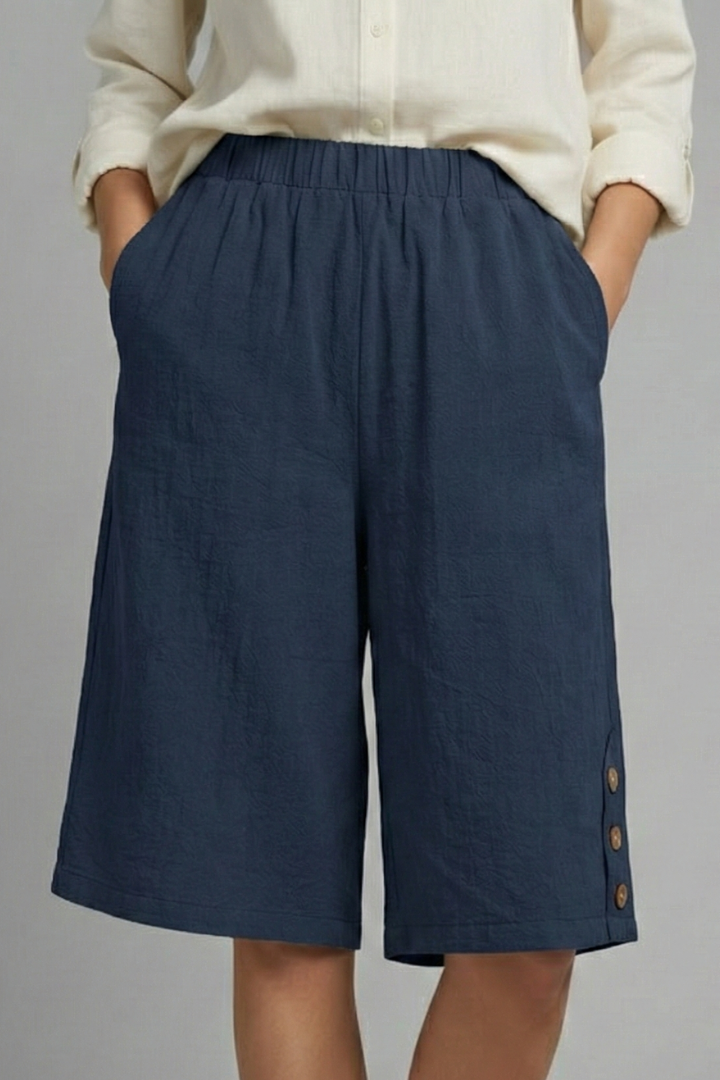 Women's casual wide leg shorts with a comfortable elastic waist and prominent button front design.