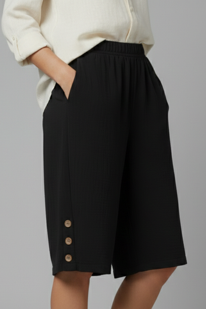 Soft women's wide leg shorts with an elastic waist and eye-catching button closures for daily wear.
