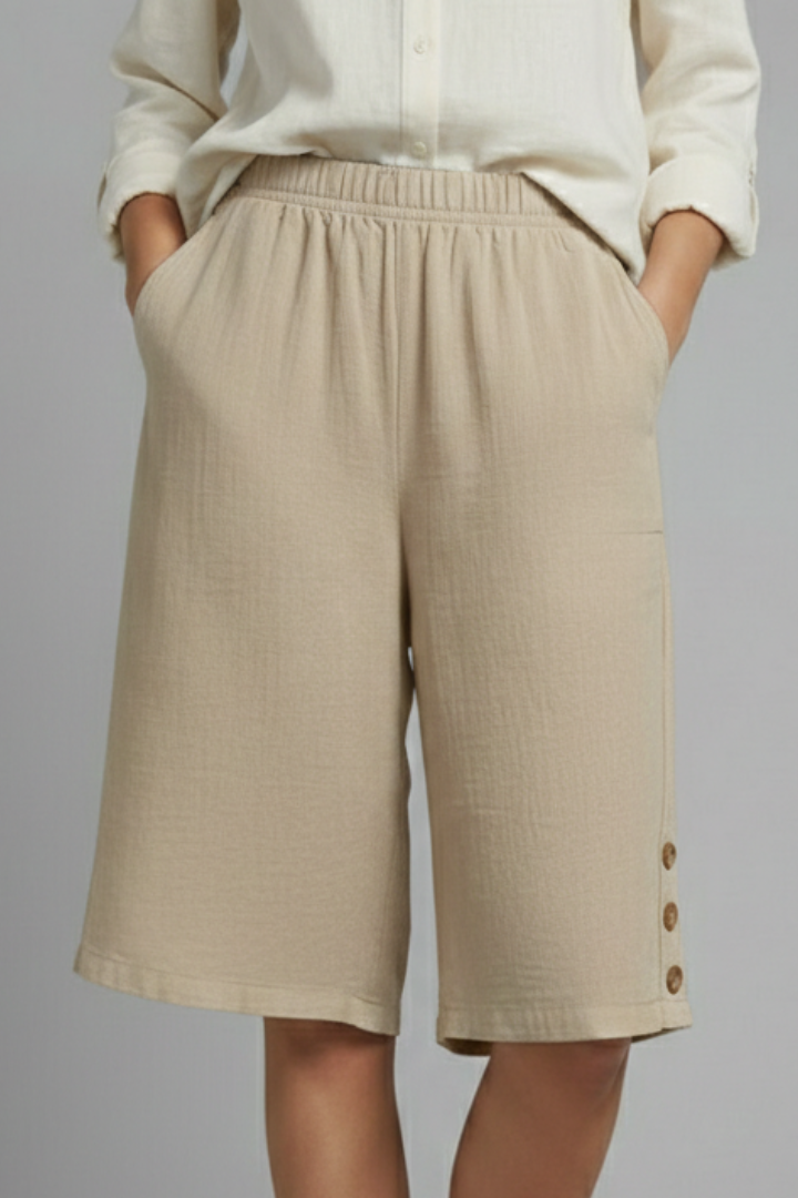 Women's loungewear shorts, wide leg with elastic waist and classic button accents for comfort.