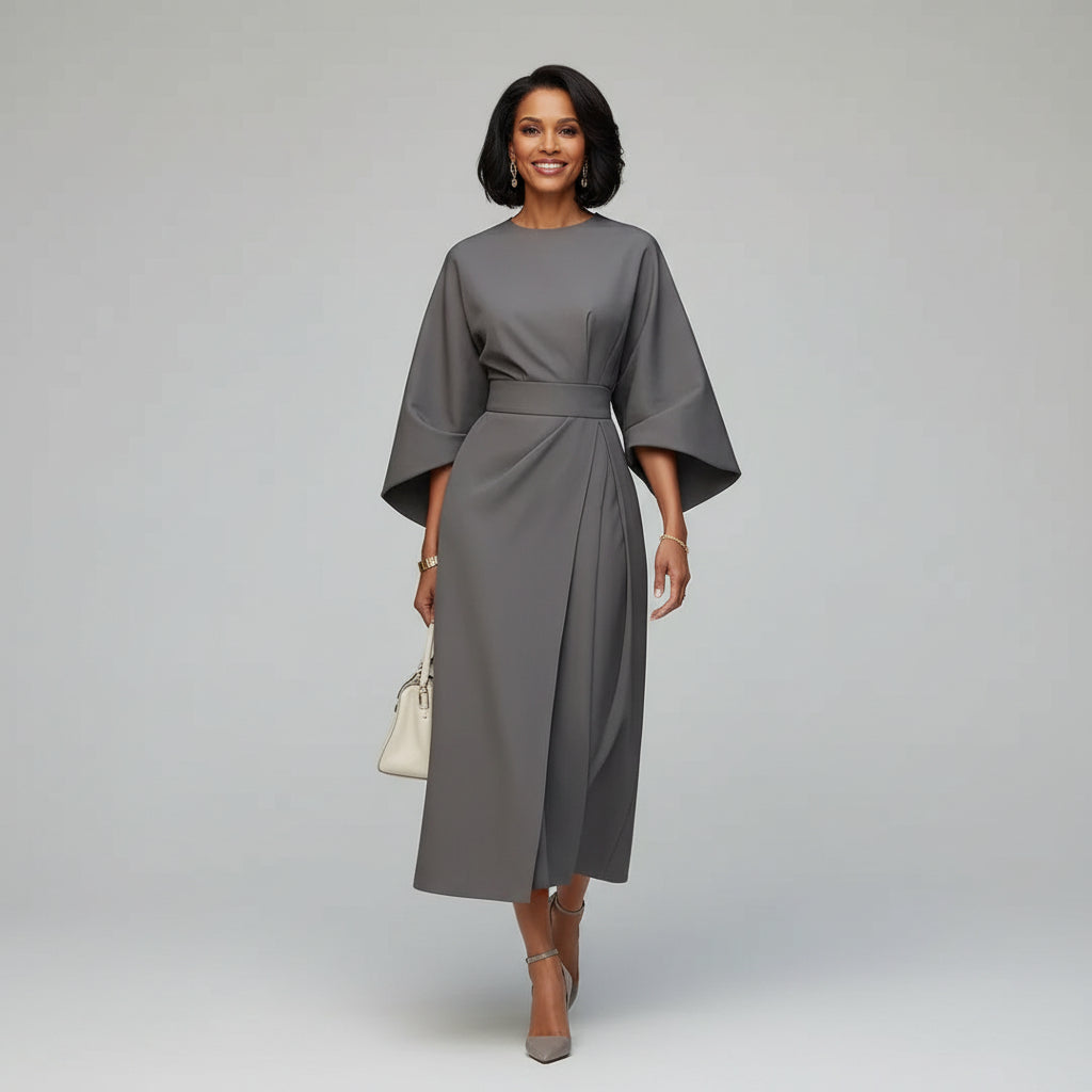 Sophisticated women's belted midi dress with elegant wide flowing sleeves. A versatile choice for spring fashion.