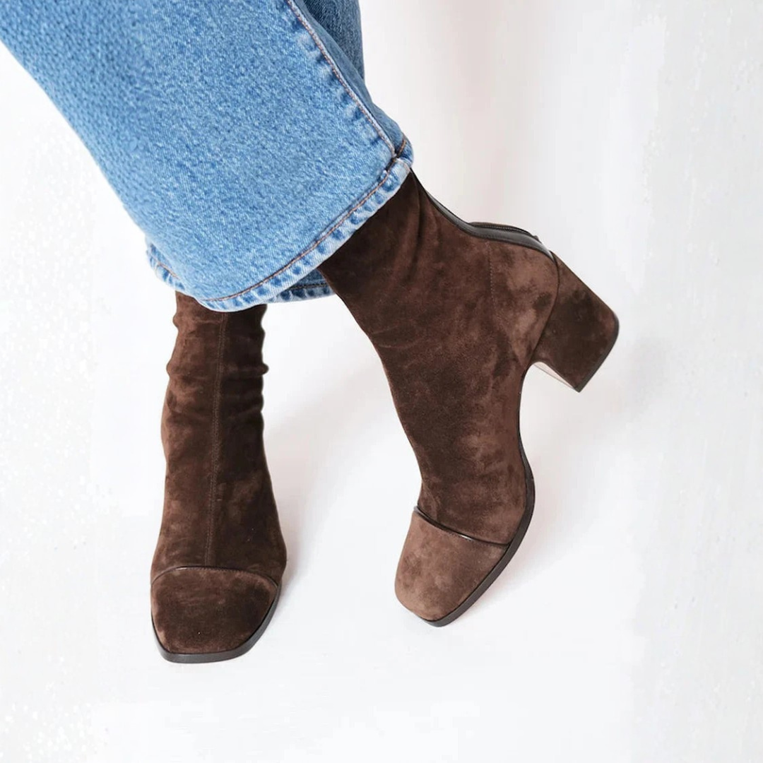 Women's elegant black comfort heel ankle boots with sturdy block heel and side zipper, perfect for winter fashion.