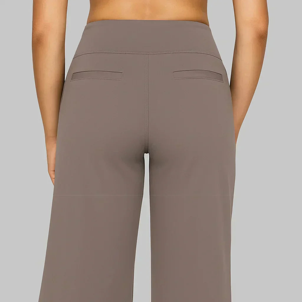 Comfortable women's high-waisted jersey trousers in a light color, ideal for warm weather style.