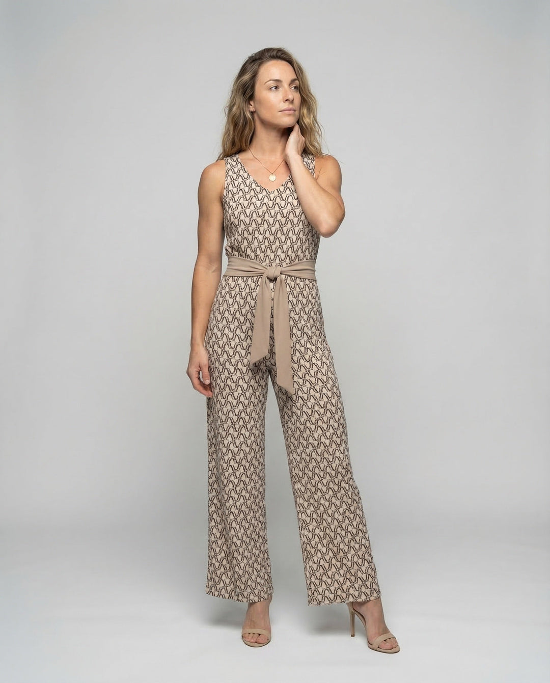Women's elegant black jumpsuit. Stylish one-piece with wide legs, perfect for chic casual or fashion events.
