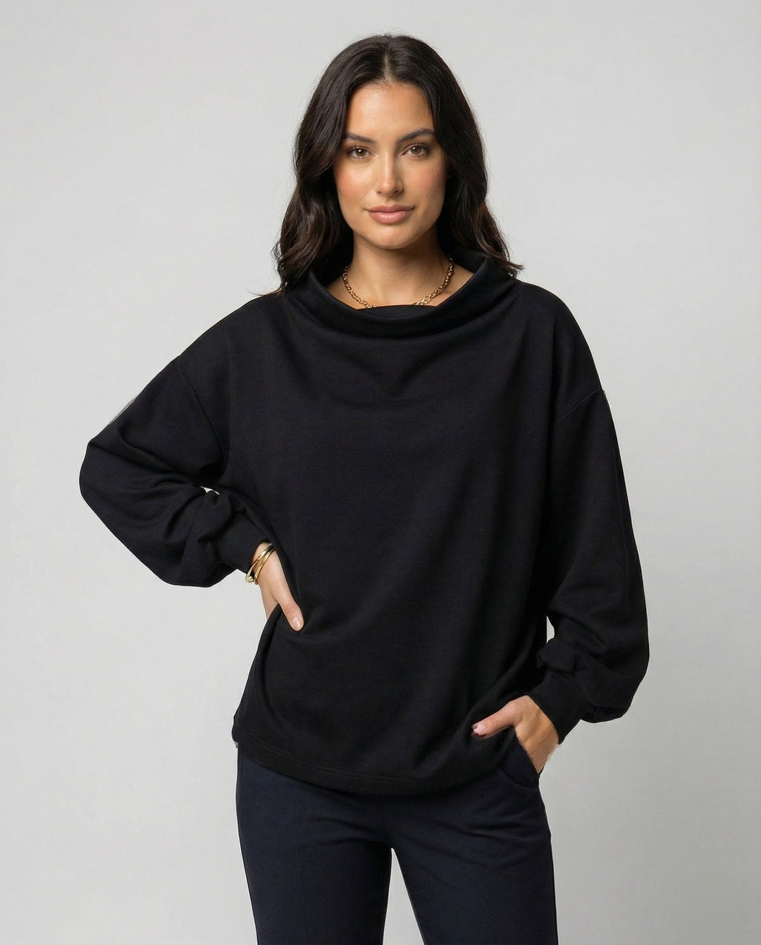 Cozy women's black knit sweater, elegant design with soft texture. Ideal for casual chic fall & winter outfits.