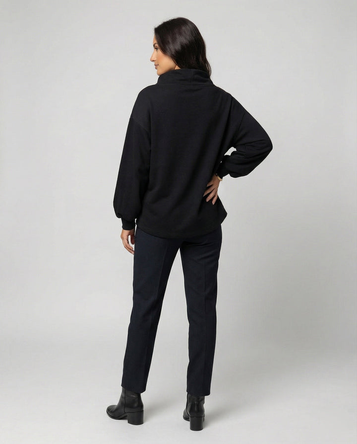 Comfortable women's long sleeve black knit sweater, offering an elegant fit for versatile fall fashion.