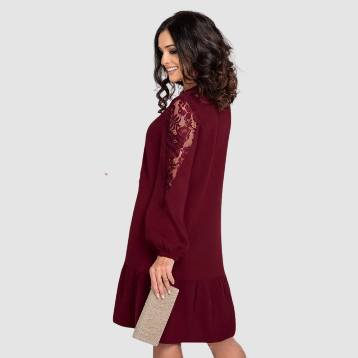 Sophisticated women's midi dress with lace sleeves, a versatile piece for elegant or casual wear in fall.