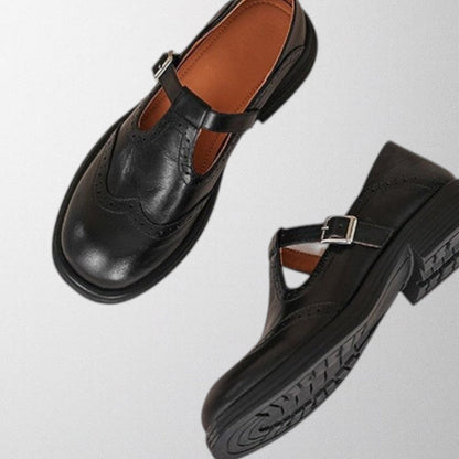 Women's perforated leather loafers, black, designed for comfort and versatile for casual or work settings