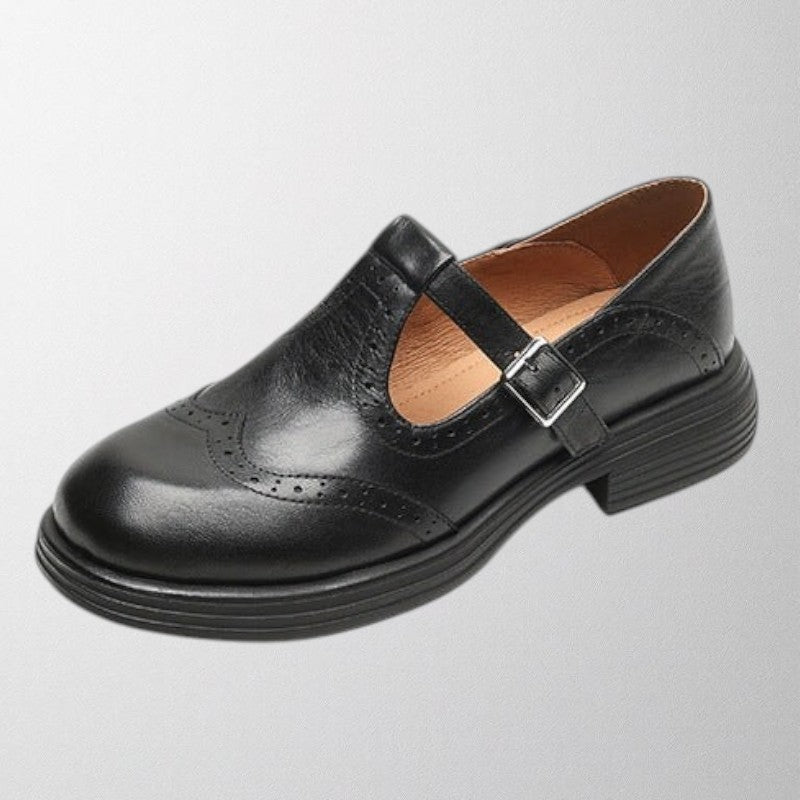 Front view of women's vintage style leather loafers, comfortable slip-on shoes with elegant perforations