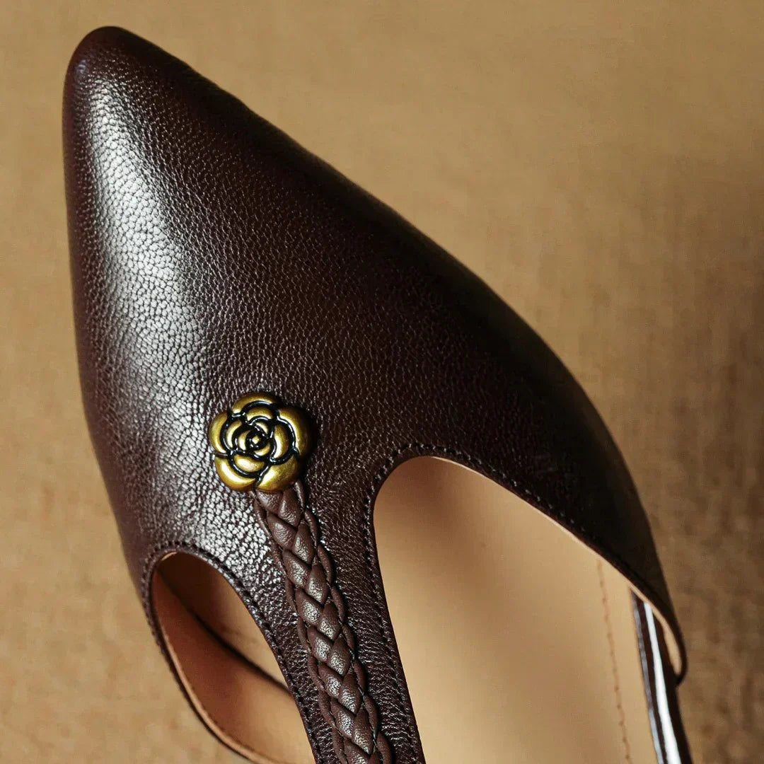 Stylish women's black leather high heel sandals with a sleek pointed toe and braided detail
