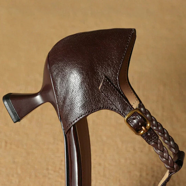 Fashionable women's heeled leather sandals, featuring a pointed toe and intricate braided strap