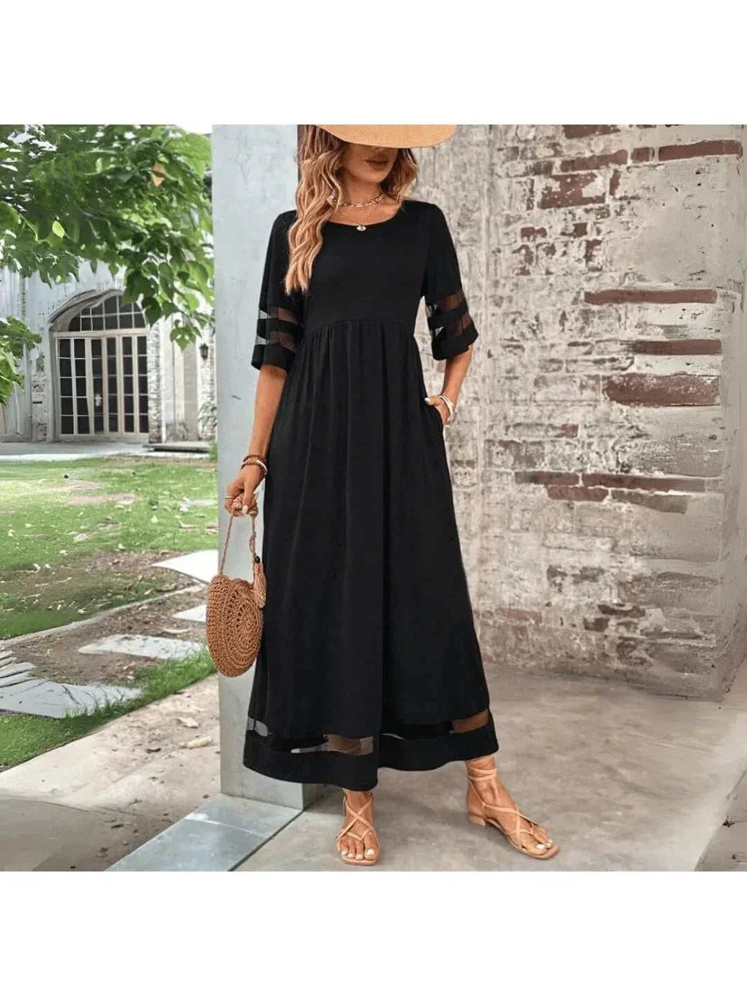 Women's elegant black midi dress with tummy coverage, empire waist, and flattering fit for chic occasion wear.