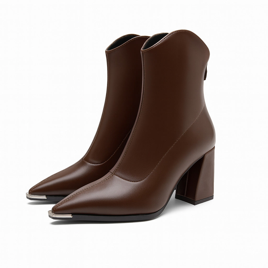Women's elegant black pointed toe ankle boots, perfect for spring fashion.
