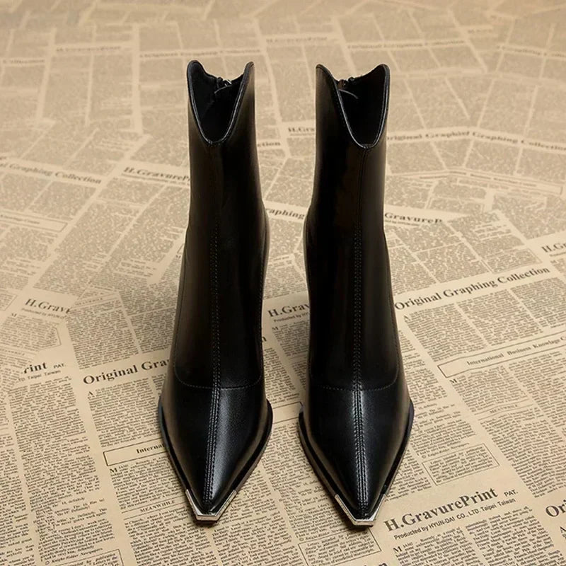Women's versatile black ankle boots, pointed toe design for modern spring style.