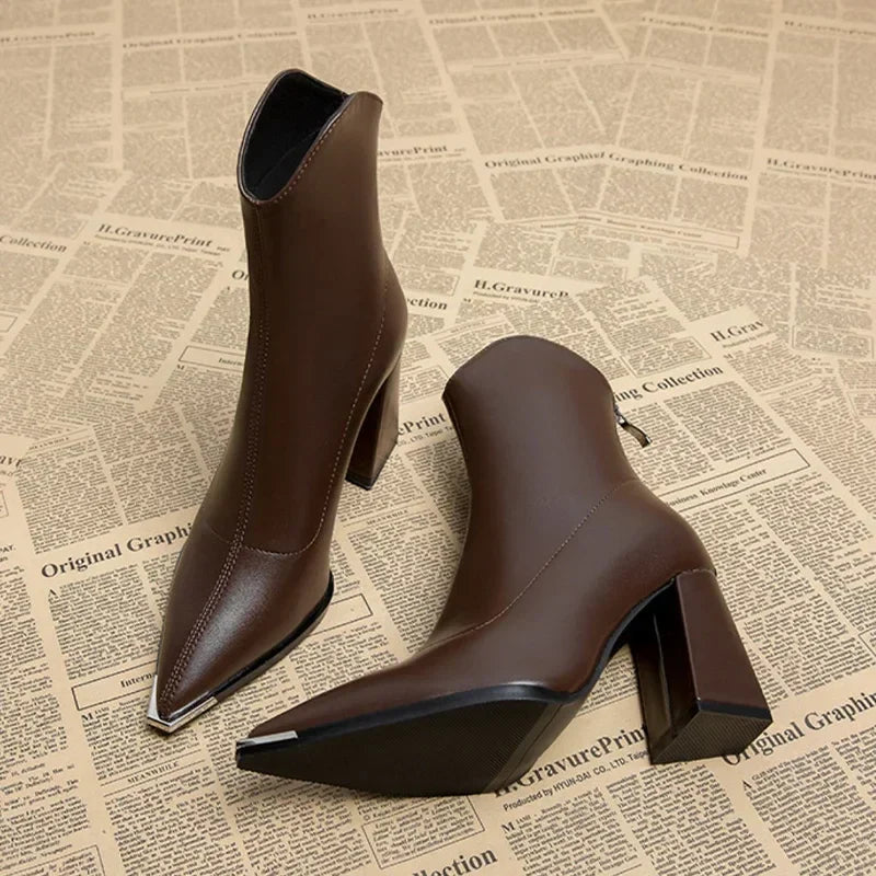Black pointed toe ankle boots for women, a comfortable yet stylish spring choice.