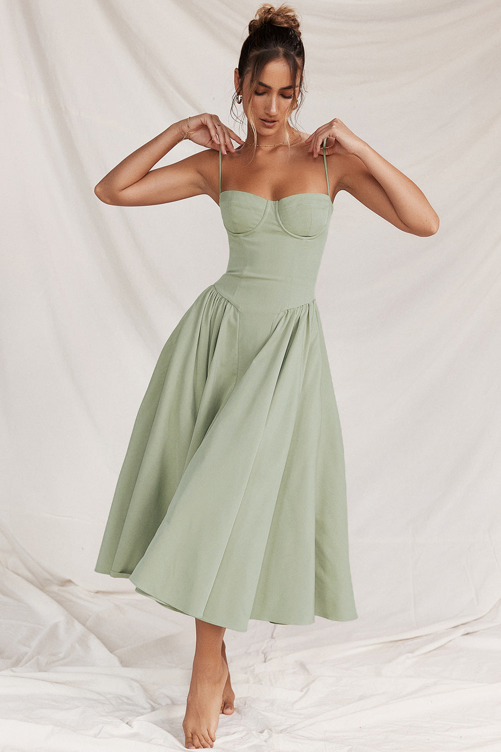 Women's elegant corset midi dress with a flattering fit, perfect for sophisticated occasion wear.