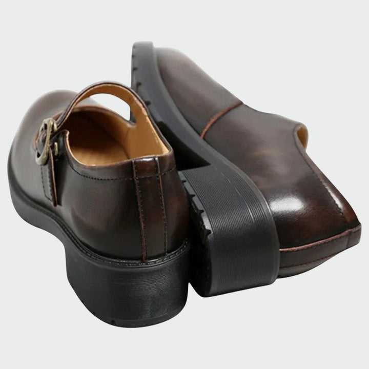 Classic dark brown Mary Jane shoes for women, featuring a comfortable block heel and elegant design.
