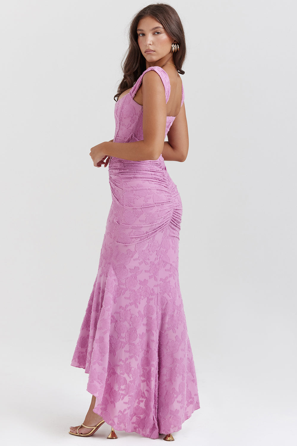 Chic women's special occasion gown: draped corset top, flowing high-low skirt.
