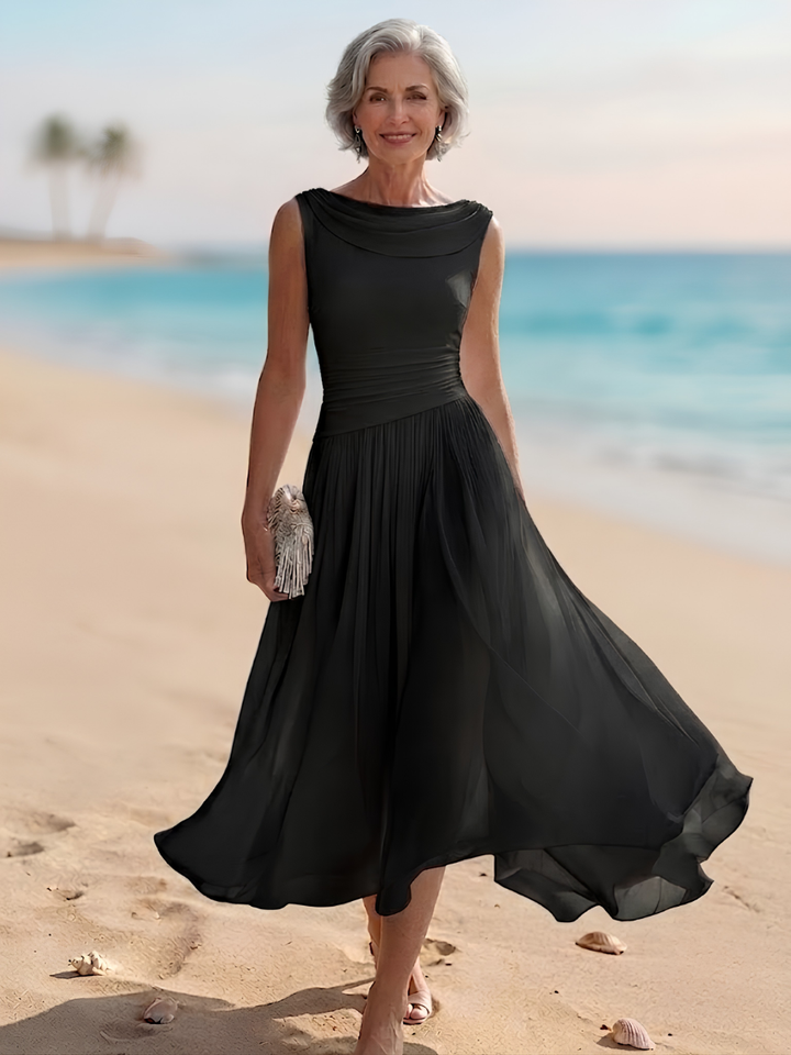 Chic women's pleated A-line midi dress, sleeveless with a beautiful draped neckline, ideal for parties.