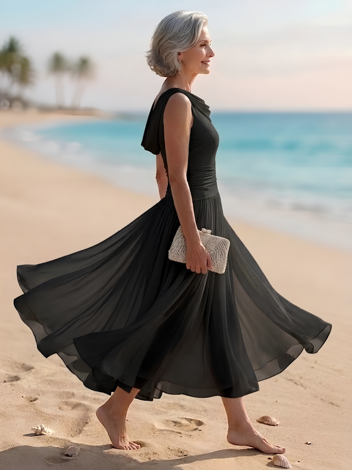 Draped neck sleeveless midi dress for women, featuring a flattering pleated A-line cut for elegant wear.