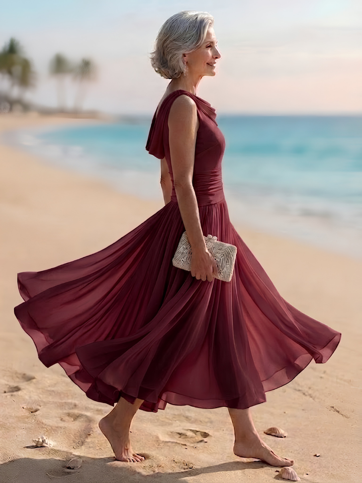 Wedding guest women's sleeveless midi dress, draped neck, pleated A-line silhouette, perfect for special events.