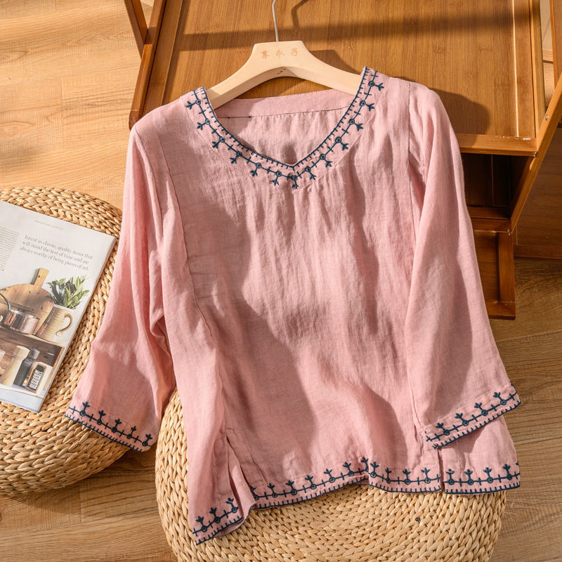 Relaxed fit V-neck blouse for women, featuring exquisite embroidery, ideal for spring fashion.