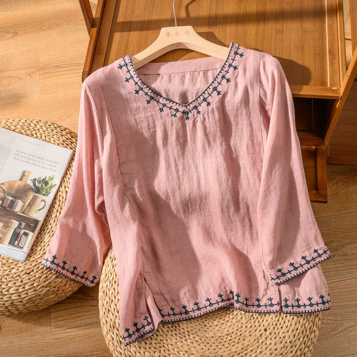 Relaxed fit V-neck blouse for women, featuring exquisite embroidery, ideal for spring fashion.