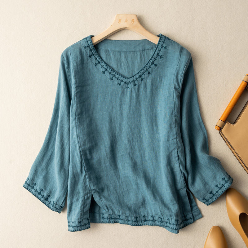 Summer style women's top: a white embroidered V-neck blouse, lightweight and comfortable.