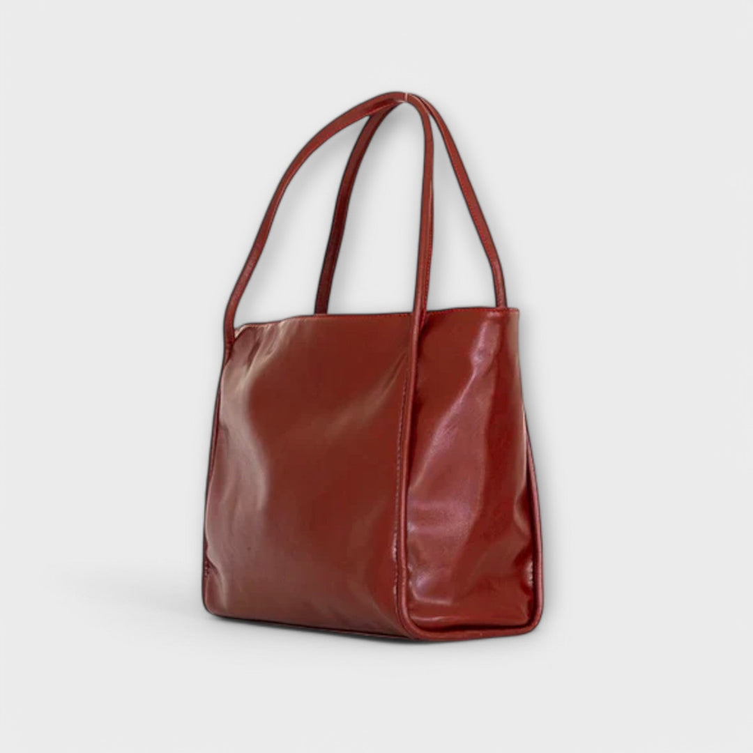 Close-up of the handle detailing on an elegant women's everyday tote bag