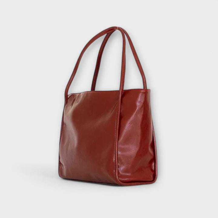 Close-up of the handle detailing on an elegant women's everyday tote bag