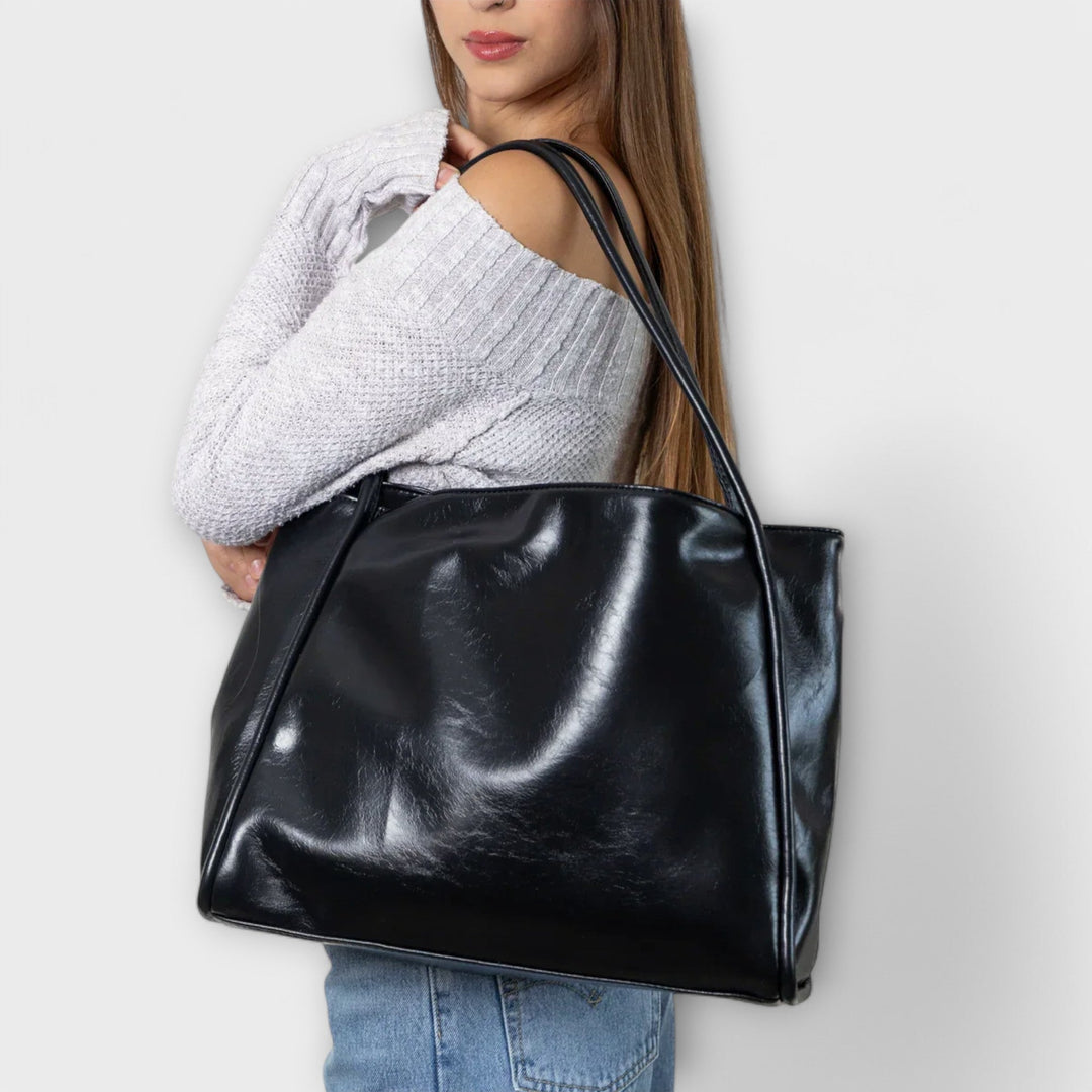 Stylish women's tote bag in a rich brown hue, suitable for everyday elegance