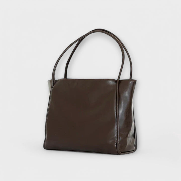 Side profile of a minimalist tote bag, showcasing its sleek design and capacity