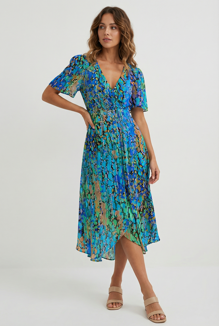 Vibrant floral print midi dress for women, featuring a flowy silhouette. Ideal for elegant summer and spring fashion.