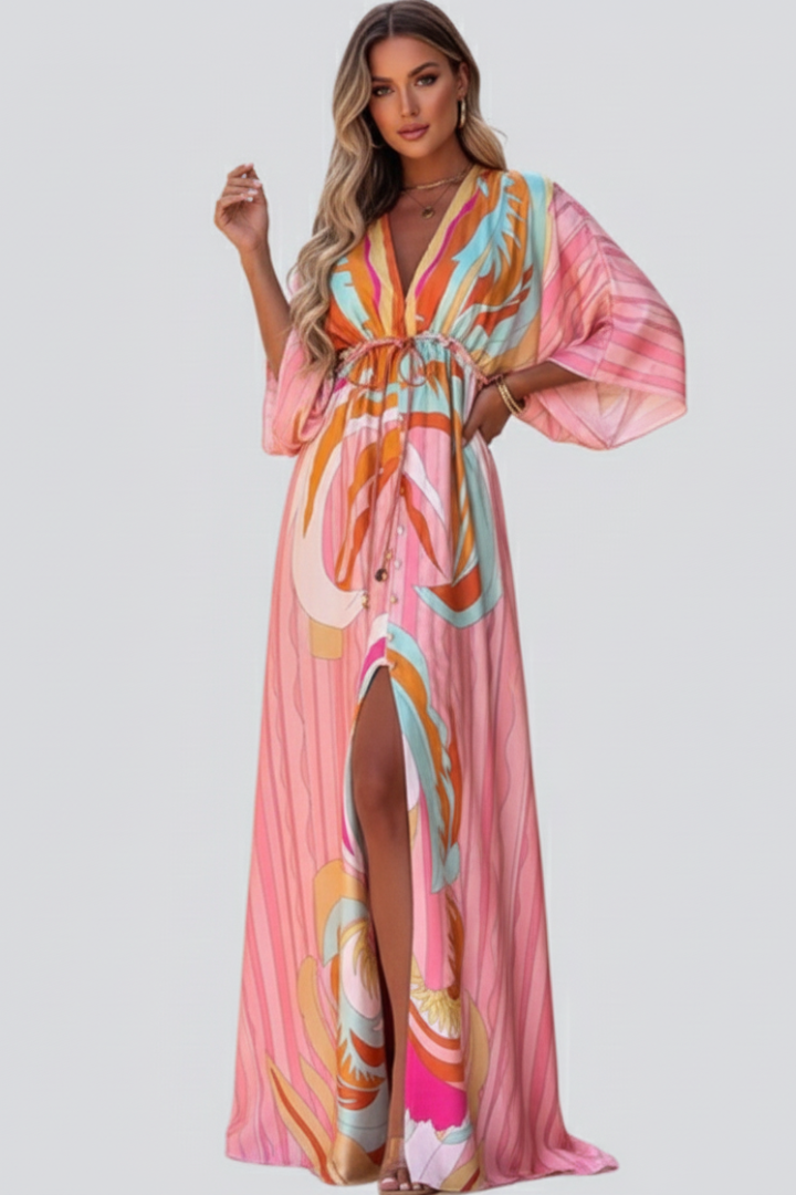Flowy women's summer maxi dress with a vibrant print and flattering V-neckline, cinched with a belt.