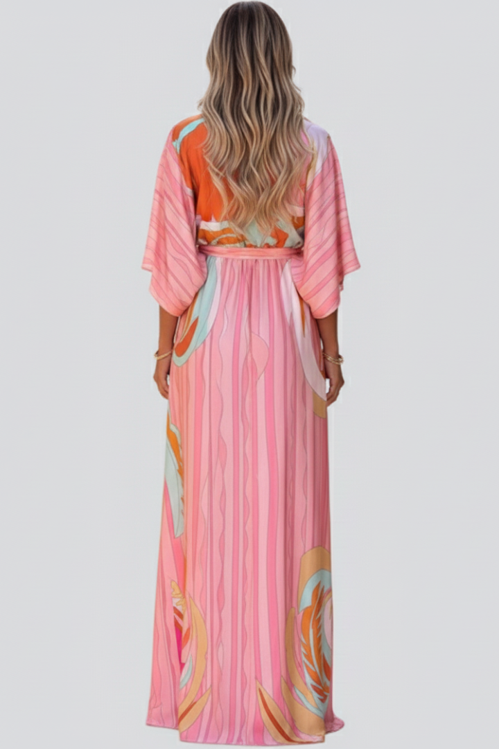 Vacation-ready women's printed maxi dress, complete with a V-neck and an adjustable belt for a flowy fit.
