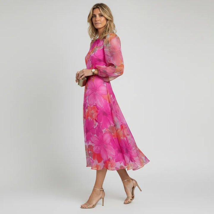 Pink floral puff sleeve midi dress. Sheer fabric, elegant design for women's summer parties & occasion wear.