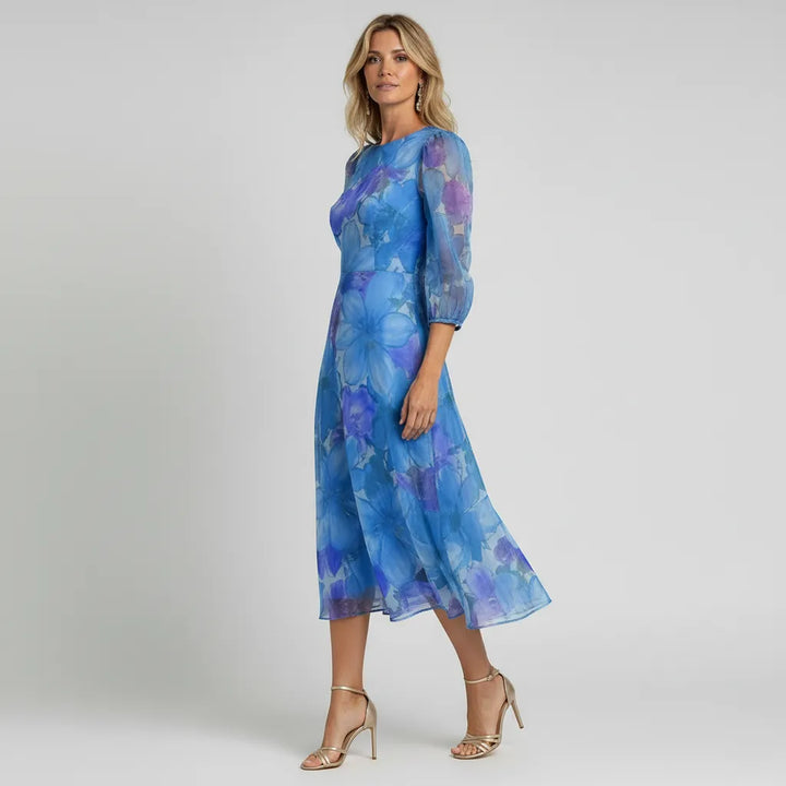 Stylish floral puff sleeve sheer midi dress for women. Elegant summer party dress, perfect for any special occasion.