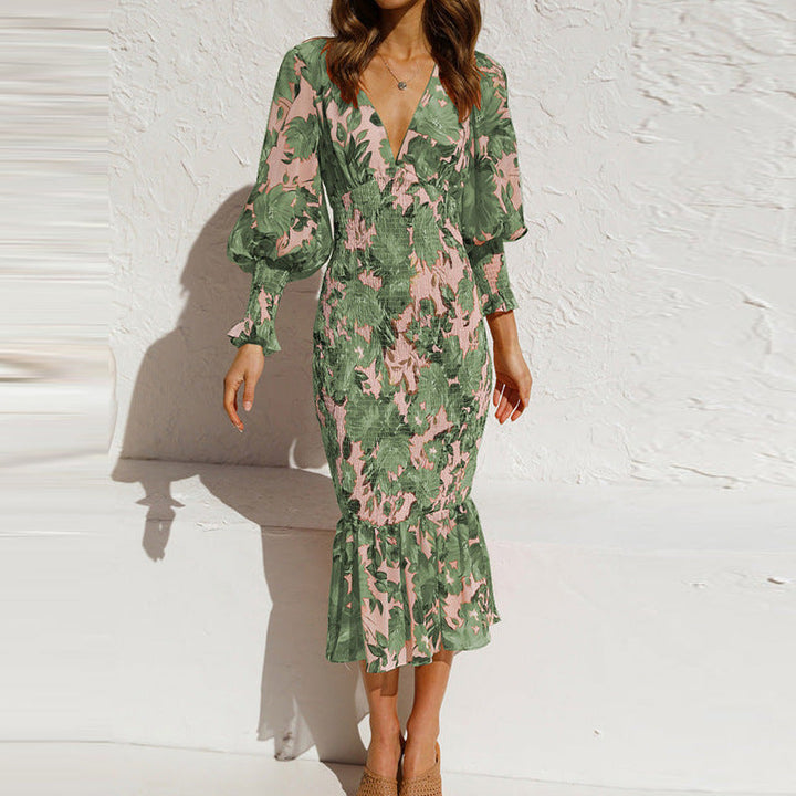 Elegant women's floral midi dress with a V-neck, long sleeves, and smocked details for a stylish summer day.