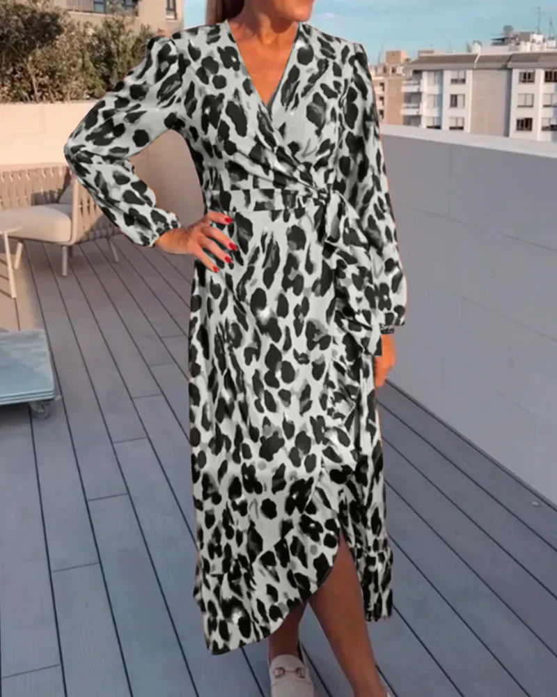 Chic women's leopard print midi dress featuring a flattering A-line silhouette and elegant V-neck design.