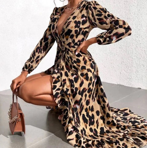 Flowy A-line midi dress for women, with a chic leopard print and elegant V-neck. Comfortable occasion wear.