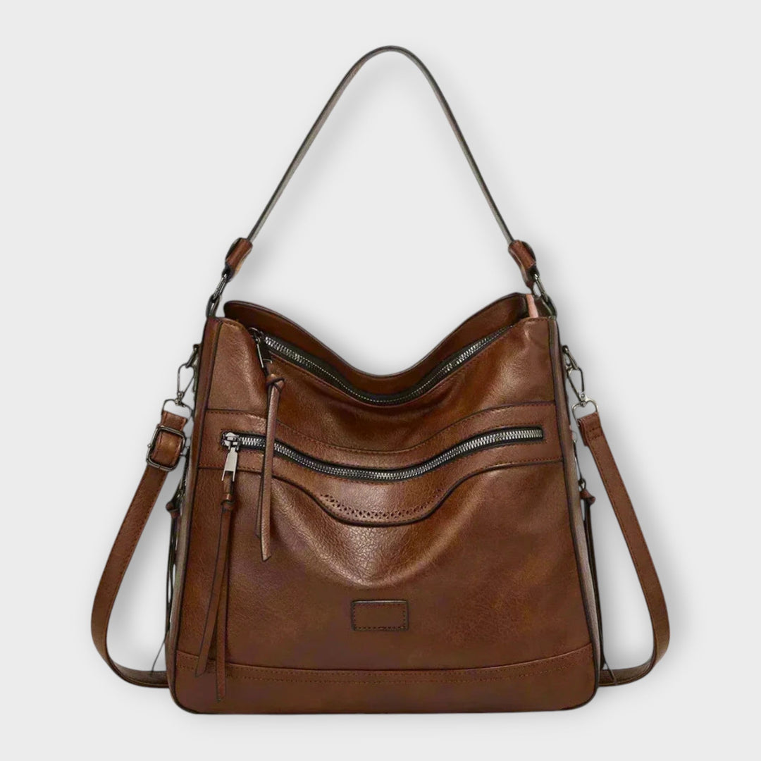 Stylish women's handbag, a modern crossbody shoulder bag with a sleek design and adjustable strap.