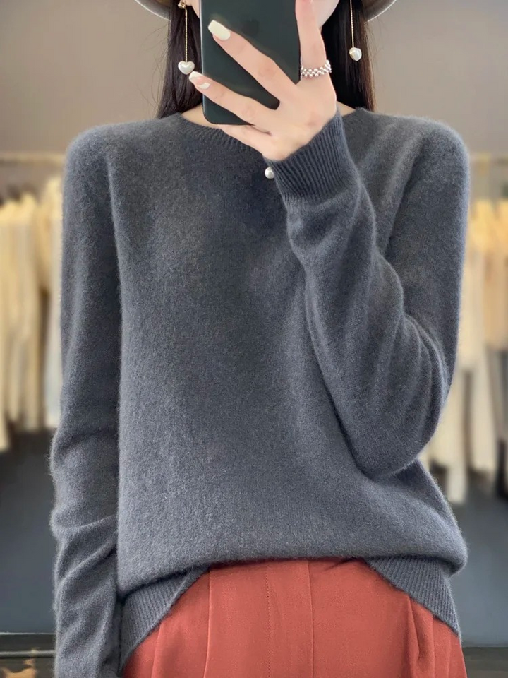 Elegant soft women's sweater, round neck pullover for chic long-sleeve comfort.